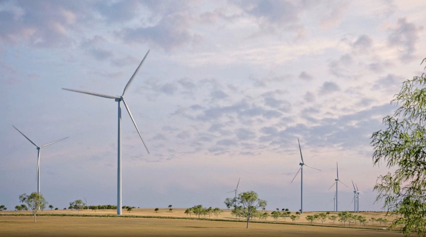 An artist's impression of the proposed wind turbines in a field with blue skies.