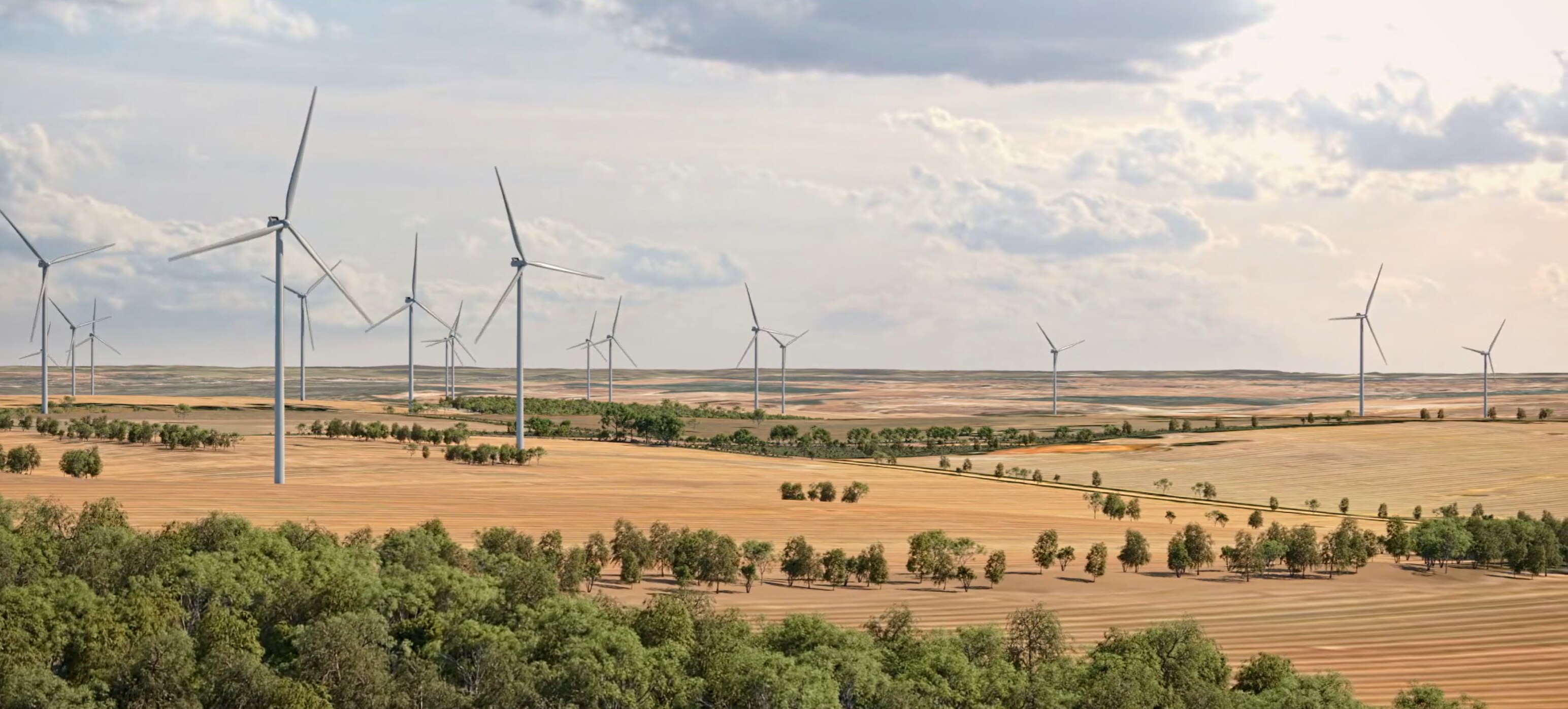Several wind turbines pictures in a golden field. There is a large cloud in the sky.